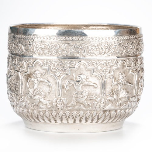 238 - A LARGE PAIR OF BURMESE SILVER BOWLS c.1910, circular, each chased with dancing figures, a band of s... 