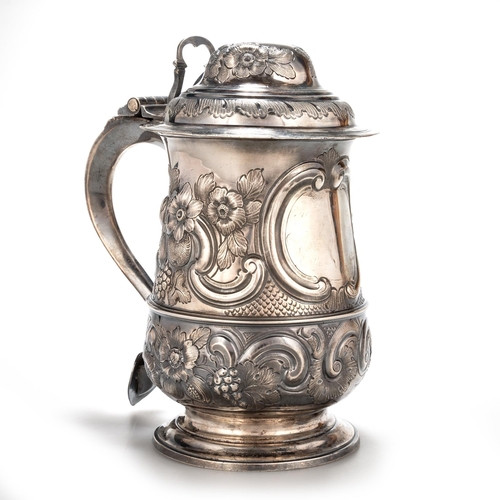 240 - A GEORGE III SILVER LIDDED TANKARD probably by William Collings, London 1778, of baluster form, the ... 