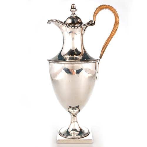 322 - A GEORGE III SILVER EWER by William Holmes, London 1777, of vase-form, with beaded borders, the cove... 