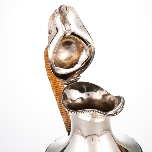 322 - A GEORGE III SILVER EWER by William Holmes, London 1777, of vase-form, with beaded borders, the cove... 