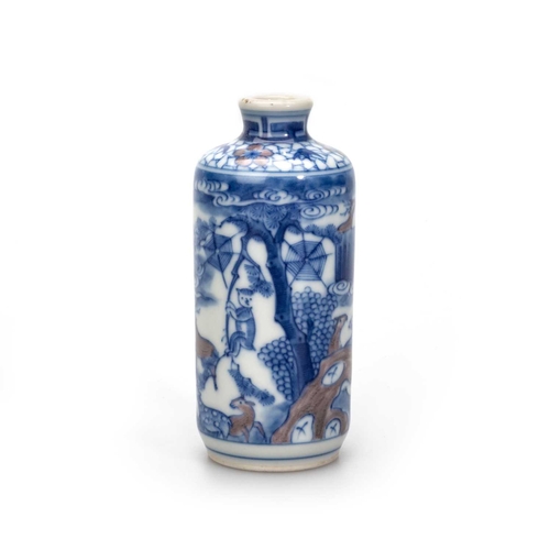 119 - A CHINESE SNUFF BOTTLE the cylindrical body painted in underglaze blue and copper-red with deer in a... 