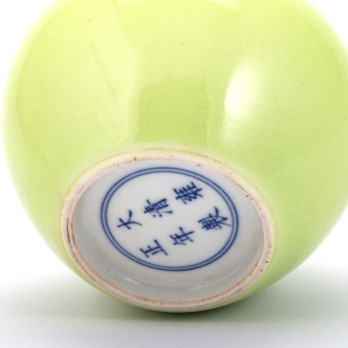 125 - A CHINESE APPLE-GREEN GLAZED BRUSH WASHER of squat circular form with a sunken neck, bears six-chara... 