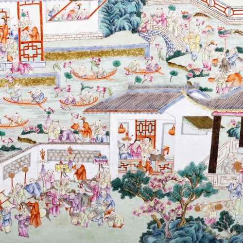 128 - A LARGE CHINESE FAMILLE ROSE PLAQUE painted with the 'One Hundred Boys' in a village setting, framed... 