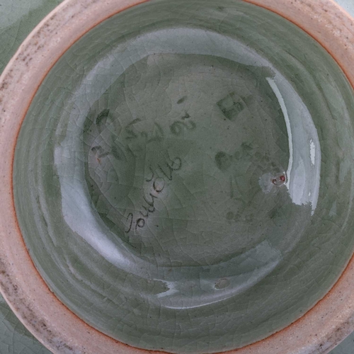 133 - A LARGE CHINESE CELADON DISH, QING DYNASTY with a barbed rim foot. 27.5cm diameter