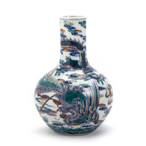 156 - A CHINESE DOUCAI 'DRAGON' BOTTLE VASE the ovoid body rising from a recessed base to a tall cylindric... 