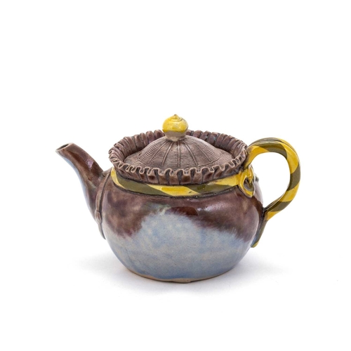 178 - A JAPANESE GLAZED EARTHENWARE TEAPOT, PROBABLY 19TH CENTURY with a 'woven' domed cover and bifurcate... 