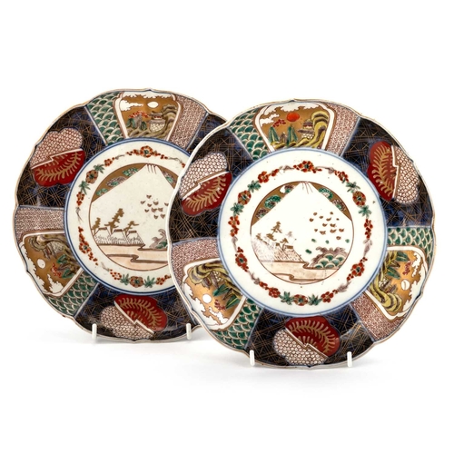 179 - A PAIR OF JAPANESE IMARI DISHES, LATE 19TH CENTURY of shaped circular form, decorated in the typical... 