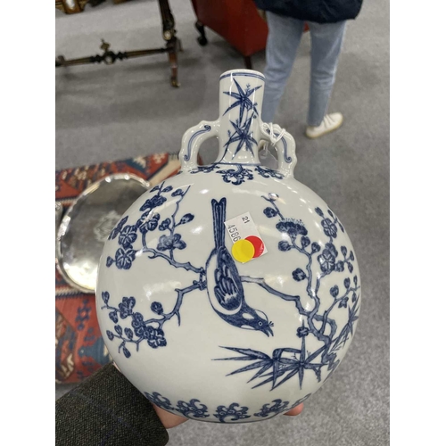 187 - A CHINESE BLUE AND WHITE MOON FLASK of oval section, painted with flower and bird compositions, the ... 