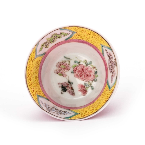 200 - A CHINESE FAMILLE ROSE TEA BOWL AND SAUCER, QIANLONG PERIOD finely potted with solid ruby-glazed bac... 