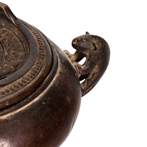 248 - A CHINESE BRONZE CENSER AND STAND the compressed globular body with applied zoomorphic handles, rais... 