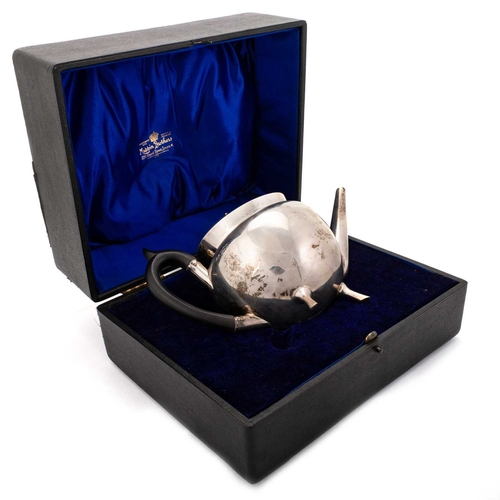 273 - A GEORGE VI SILVER TEAPOT by Mappin & Webb, Sheffield 1951, circular form, with an ebonised wood... 