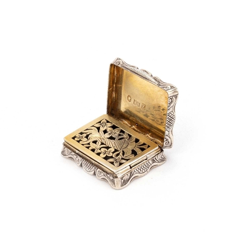 289 - A VICTORIAN SILVER CASTLE-TOP VINAIGRETTE by Edward Smith, Birmingham 1848, shaped rectangular form,... 