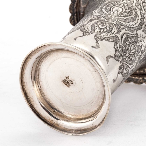 299 - A 20TH CENTURY PERSIAN SILVER VASE marked on the underside, the flared body with a downturned petal ... 