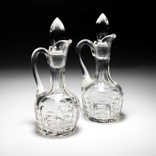 328 - AN ITALIAN SILVER CRUET STAND marked 800, for two bottles, with cast leafy borders and a central car... 