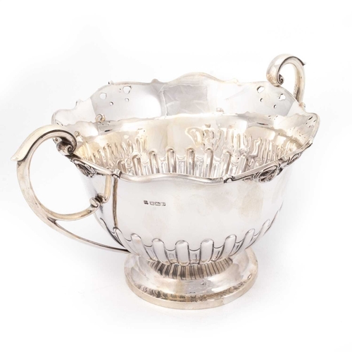 355 - A LARGE GEORGE V SILVER TWO-HANDLED BOWL by Martin, Hall & Co, Sheffield 1916, with a partially ... 