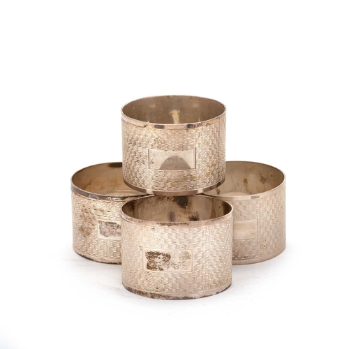 356 - A SET OF FOUR GEORGE VI SILVER NAPKIN RINGS by V Brittain & Co, Birmingham 1947, each circular, ... 