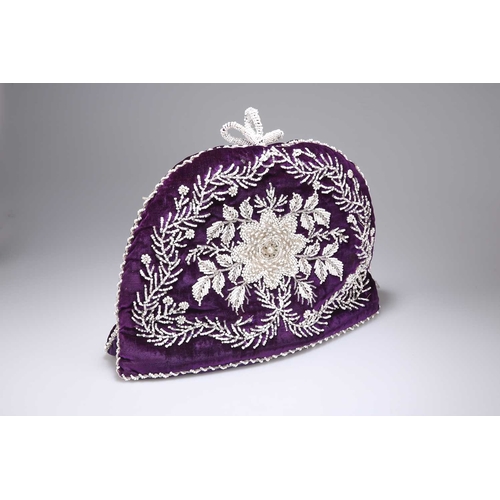 4 - A VICTORIAN BEADWORK TEA COSY of large proportions, the padded purple velvet worked with beads to fo... 