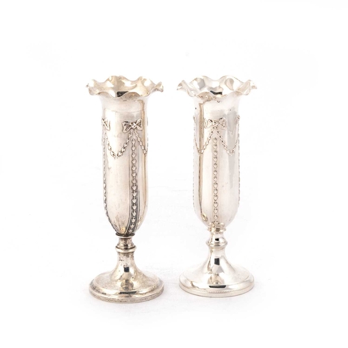 402 - A PAIR OF LATE VICTORIAN SILVER VASES by Turner Bradbury, London 1900, the cylindrical bodies with u... 