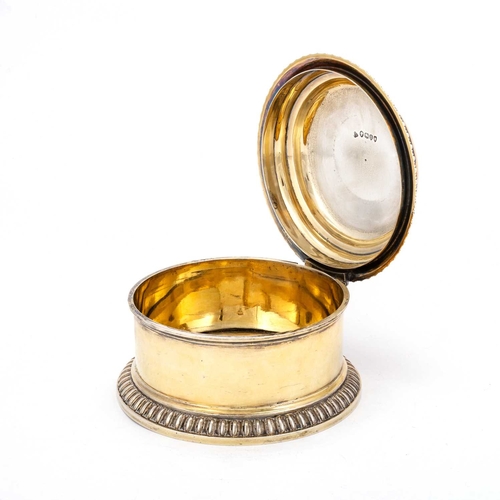 415 - A VICTORIAN SILVER AND SILVER-GILT TABLE BOX by Francis Boone Thomas, London 1884, circular with a h... 