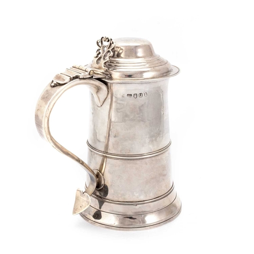 423 - A GEORGE III SILVER LIDDED TANKARD by Peter and Anne Bateman, London 1815, the stepped domed cover w... 