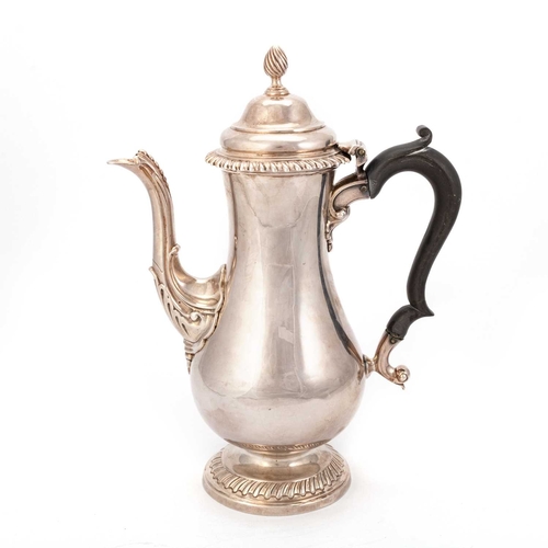 444 - AN EARLY GEORGE III SILVER COFFEE POT maker LH (possibly Louis Herne), London 1768, of cast baluster... 