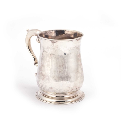 458 - A GEORGE II SILVER PINT MUG by Fuller White, London 1749, baluster form, with a double scroll handle... 