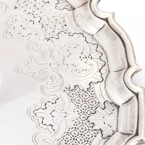 460 - A GEORGE II SILVER SALVER by William Kidney, London 1735, shaped-circular with flat-chased acanthus,... 