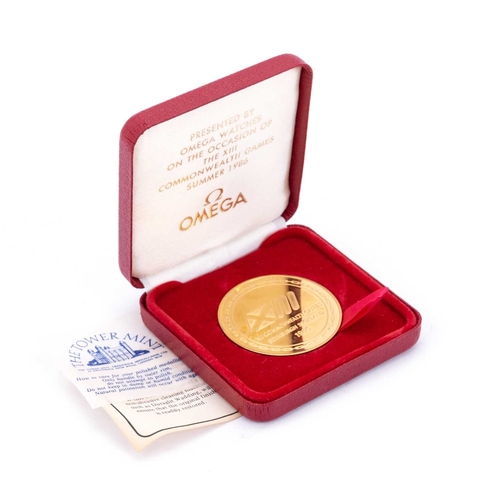 477 - A THE TOWER MINT COMMEMORATIVE GOLD PLATED OMEGA MEDALLION Presented by Omega Watches on the occasio... 