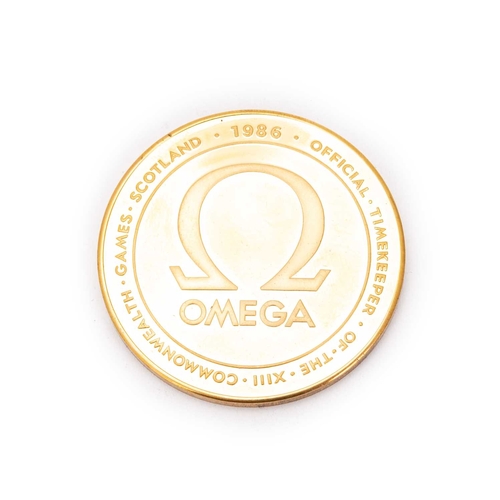 477 - A THE TOWER MINT COMMEMORATIVE GOLD PLATED OMEGA MEDALLION Presented by Omega Watches on the occasio... 