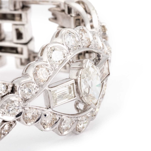 588 - AN ART DECO STYLE DIAMOND COCKTAIL BRACELET unmarked, having three navette shaped links, each set wi... 