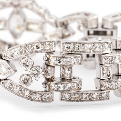 588 - AN ART DECO STYLE DIAMOND COCKTAIL BRACELET unmarked, having three navette shaped links, each set wi... 