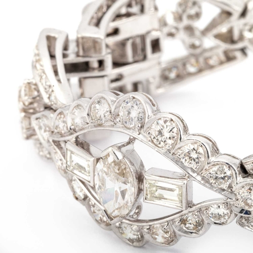 588 - AN ART DECO STYLE DIAMOND COCKTAIL BRACELET unmarked, having three navette shaped links, each set wi... 