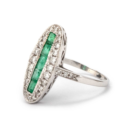 618 - AN 18 CARAT WHITE GOLD EMERALD AND DIAMOND ART DECO STYLE OVAL RING set with five square-cut emerald... 