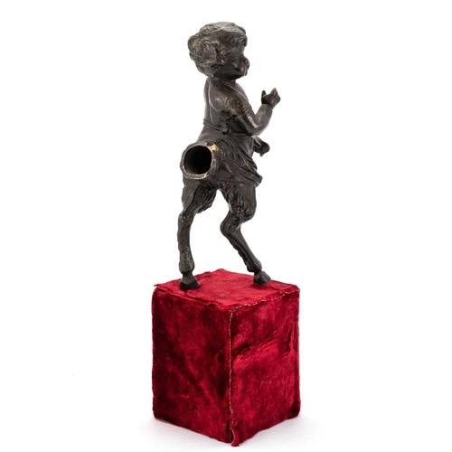 630 - A PAIR OF 19TH CENTURY BRONZE CHERUBIC FAUNS once forming part of a candelabra, raised on velvet pli... 