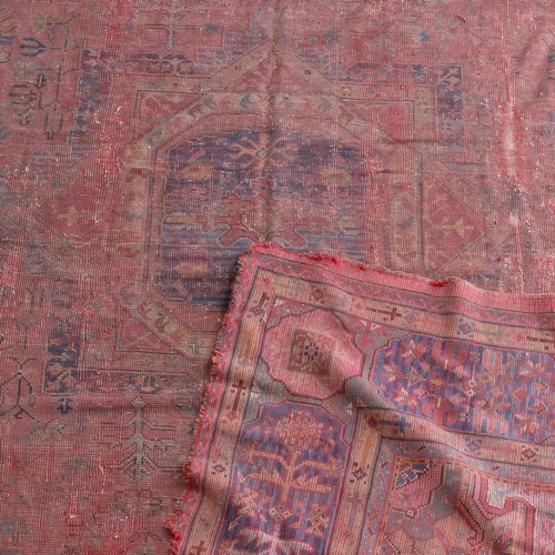 707 - AN ANTIQUE USHAK CARPET 490cm by 374cm