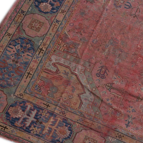 707 - AN ANTIQUE USHAK CARPET 490cm by 374cm