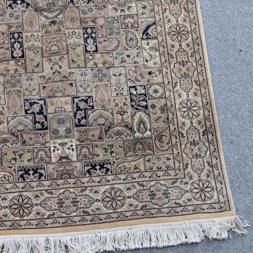 710 - A MACHINE-MADE RUG 238m by 138cm