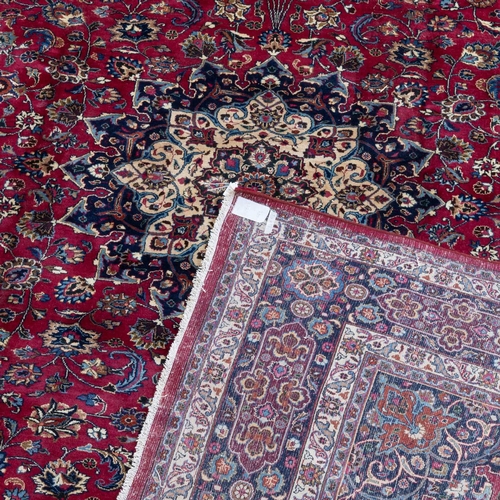 711 - A PERSIAN MASHAD CARPET 380cm by 292cm