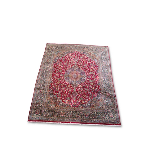 713 - A PERSIAN MASHAD CARPET 381cm by 289cm