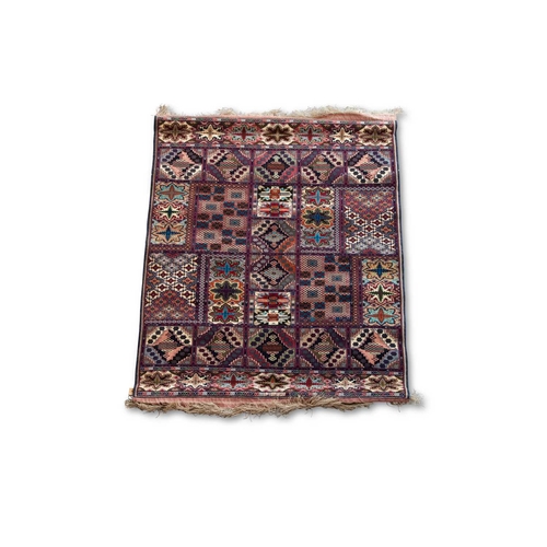 714 - A SILK AFGHAN CARPET 159cm by 117cm