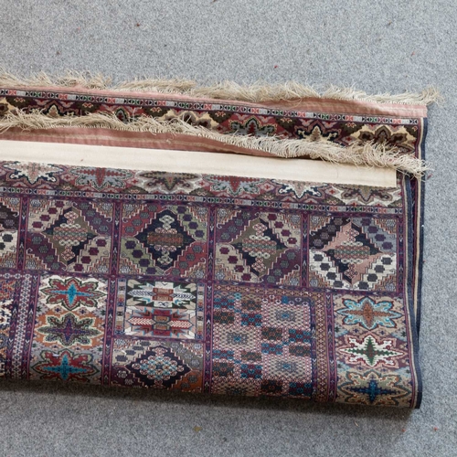 714 - A SILK AFGHAN CARPET 159cm by 117cm