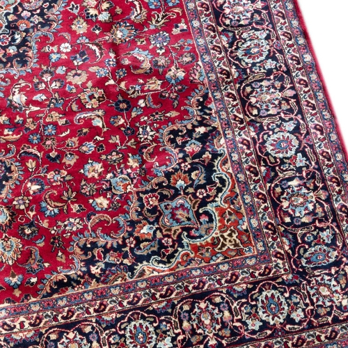 715 - A PERSIAN KASHAN CARPET 345cm by 250cm