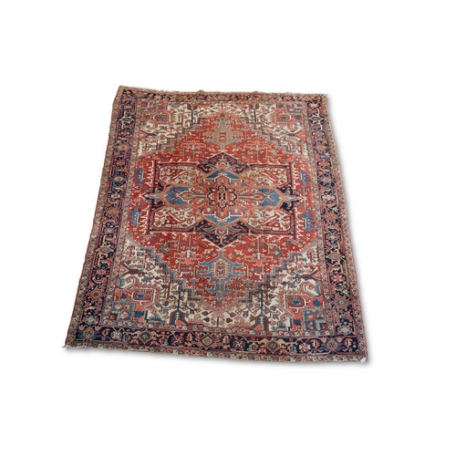 718 - AN ANTIQUE HERIZ CARPET 334cm by 248cm