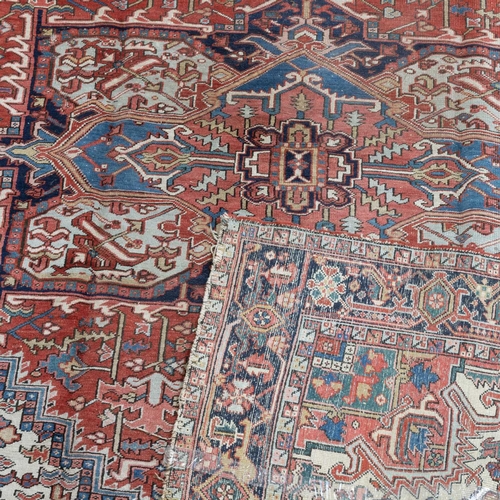 718 - AN ANTIQUE HERIZ CARPET 334cm by 248cm