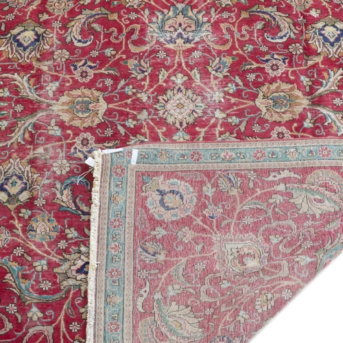 722 - A PERSIAN TABRIZ CARPET 325cm by 220cm