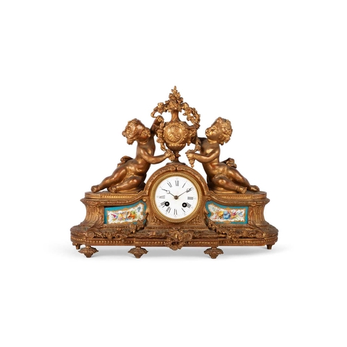 726 - A 19TH CENTURY FRENCH GILT-BRASS MANTEL CLOCK surmounted by the figures of two putti flanking a vase... 