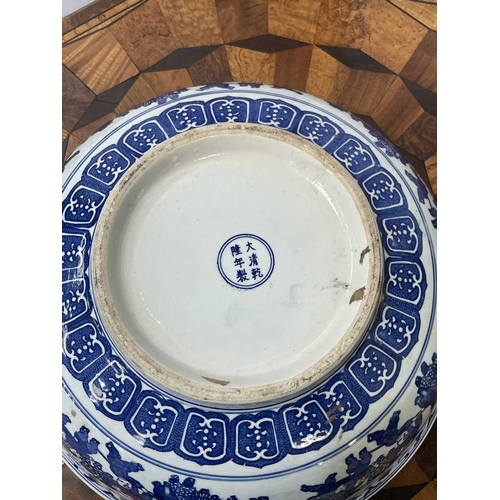 758 - A CHINESE CARVED AND RED LACQUERED ELM WASHSTAND WITH A CHINESE BLUE AND WHITE PORCELAIN BOWL the st... 