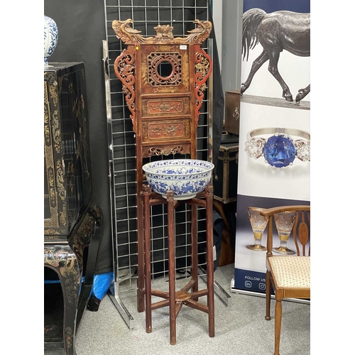 758 - A CHINESE CARVED AND RED LACQUERED ELM WASHSTAND WITH A CHINESE BLUE AND WHITE PORCELAIN BOWL the st... 