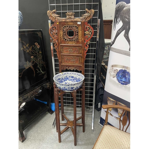 758 - A CHINESE CARVED AND RED LACQUERED ELM WASHSTAND WITH A CHINESE BLUE AND WHITE PORCELAIN BOWL the st... 