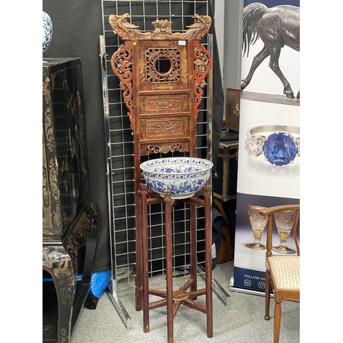 758 - A CHINESE CARVED AND RED LACQUERED ELM WASHSTAND WITH A CHINESE BLUE AND WHITE PORCELAIN BOWL the st... 